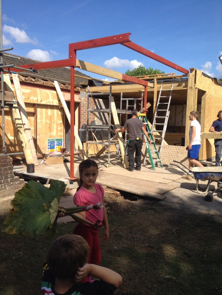 ...Or is big sister about to whack him with the rhubarb?!